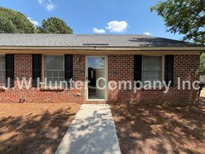 Wilson apartment for rent - A house with a sign that says "J W Hunter Company Inc" on the front.