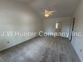 Wilson apartment for rent - A room with a ceiling fan and carpeted floor.
