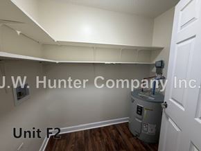 Wilson apartment for rent - A room with a J.W. Hunter Company Inc. sign on the wall.