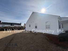 Wilson apartment for rent - A white building with the name J.W. Hunter Company, Inc. on it.