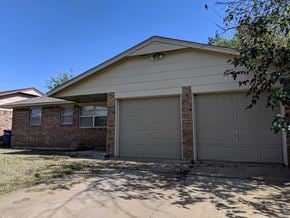 Stillwater house for rent - A house with a garage and a driveway.