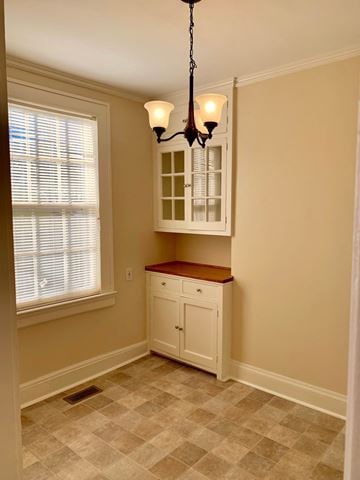Wilson house for rent - a small kitchen with a white cabinet and a window