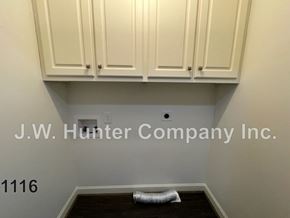 Wilson apartment for rent - A room with white cabinets and a number 1116 on the wall.