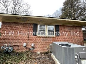 Wilson apartment for rent - A brick building with the name J.W. Hunter Company Inc. on it.