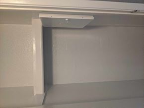 Phoenix house for rent - A white shelf bracket is mounted on a white wall.