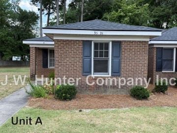 Wilson apartment for rent - A brick house with the number 35 21 on the roof and the name J.W. Hunter Company Inc written on the front.