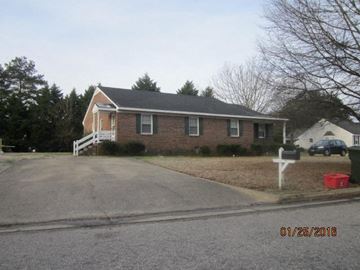 Wilson apartment for rent - a brick house on the corner of a street