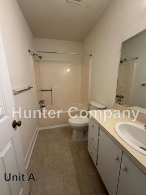 Wilson apartment for rent - A Hunter Company bathroom with a toilet, sink and shower.