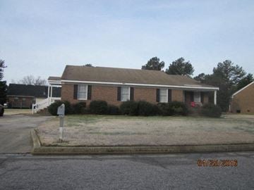 Wilson apartment for rent - a brick house on the side of a street