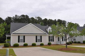 Rocky Mount apartment for rent - a white house with black shutters and a tree