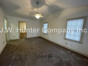 Wilson apartment for rent - A room with a carpet floor and a ceiling fan is labeled as Unit B.