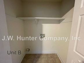 Wilson apartment for rent - A white room with a J.W. Hunter Company, Inc. sign on the wall.
