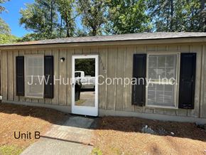 Wilson apartment for rent - A wooden building with Unit B written on the ground in front of it.