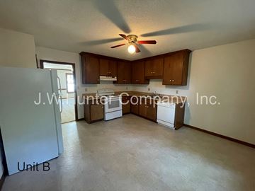 Wilson apartment for rent - A J.W. Hunter Company, Inc. logo is on the wall of a kitchen.