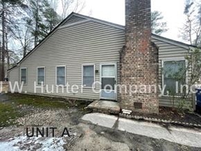 Wilson apartment for rent - A house with the text "J.W. Hunter Company, Inc." and "UNIT A" on it.