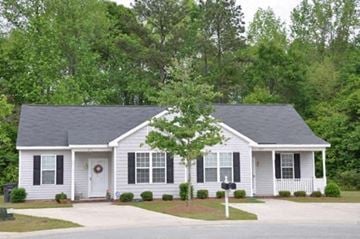 Rocky Mount apartment for rent - a white house with black shutters and a tree in the front