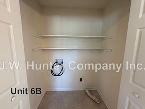 Wilson apartment for rent - A white closet with shelves and a sign that says J.W. Hunter Company Inc.