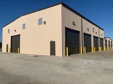 Lumberton apartment for rent - a large building with several garage doors
