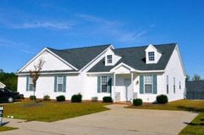 Wake Forest apartment for rent - A white house with a black roof and a grey front porch.