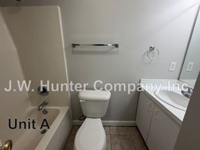 Wilson apartment for rent - A white toilet in a bathroom with a J.W. Hunter Company Inc watermark.