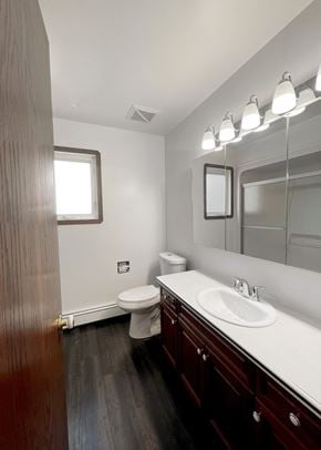 Edmonton apartment for rent - an empty bathroom with a sink toilet and mirror