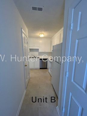 Wilson apartment for rent - A hallway in a building with the words "Unit B" on the floor.