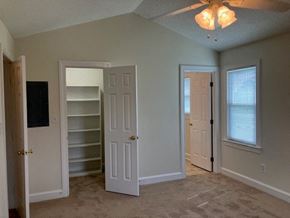 Wilson house for rent - an empty room with a closet and a door
