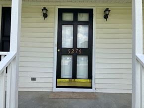 Wilson house for rent - the front door of a house with a black door