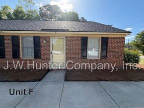 Wilson apartment for rent - A brick house with the name J.W. Hunter Company, Inc. on it.