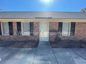 Wilson apartment for rent - The front of a building with the name J.W. Hunter Company Inc. on it.