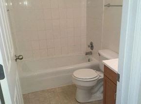 New Baden apartment for rent - a white bathroom with a toilet and a tub