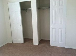 New Baden apartment for rent - an empty room with a closet and two doors