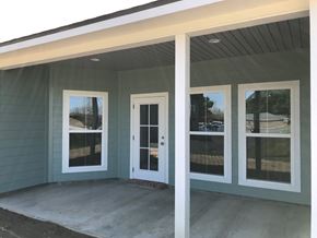 Eunice apartment for rent - the windows and doors are installed on the front porch of a home