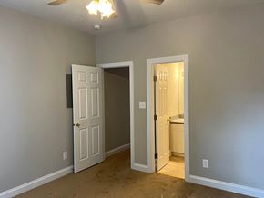 Wilson apartment for rent - A room with two doors, one of which is open.