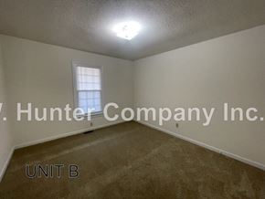 Wilson apartment for rent - A room with a window and carpeted floor.