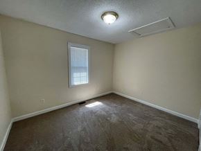 Wilson apartment for rent - A room with a window and a ceiling light.