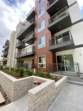 North Hollywood apartment for rent - an apartment building with a courtyard in front of it