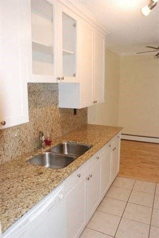 Edmonton apartment for rent - A kitchen with a sink and cabinets.