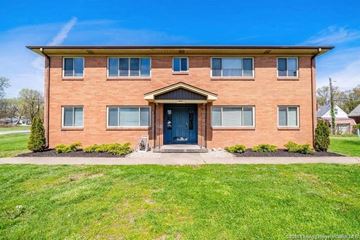 Clarksville apartment for rent - the front of a brick house with a blue door