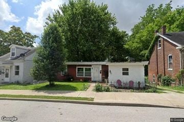 Belleville house for rent - a red and white house on the side of a street