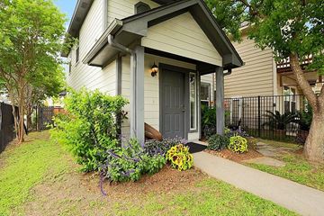 Houston house for rent - the front door of a house with plants and a sidewalk