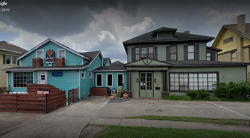 Houston apartment for rent - the front of a blue house and a yellow and