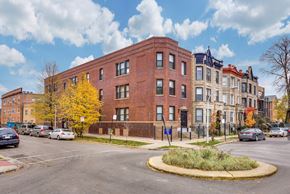 Chicago apartment for rent - a red brick building on the corner of a city street