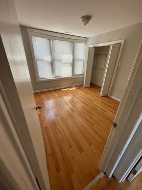 Chicago apartment for rent - a room with a hard wood floor and a window
