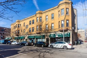 Chicago apartment for rent - A street view of a building with cars parked in front and a sign that says "Lonny Mac's.".