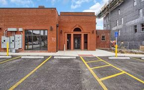 St. Louis apartment for rent - the front of a brick building with a parking lot