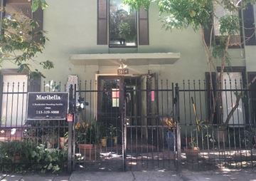 Houston apartment for rent - a building with a fence and a gate in front of it