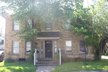 Houston apartment for rent - an old brick house with a black door