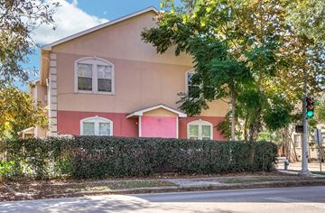 Houston apartment for rent - a pink house with a traffic light in front of it