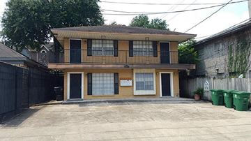 Houston apartment for rent - the front of a house with a parking lot